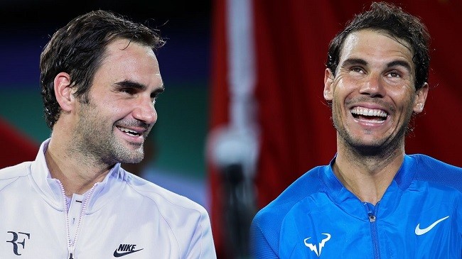 Federer (left) and Nadal laugh together following a match in Shanghai in 2017